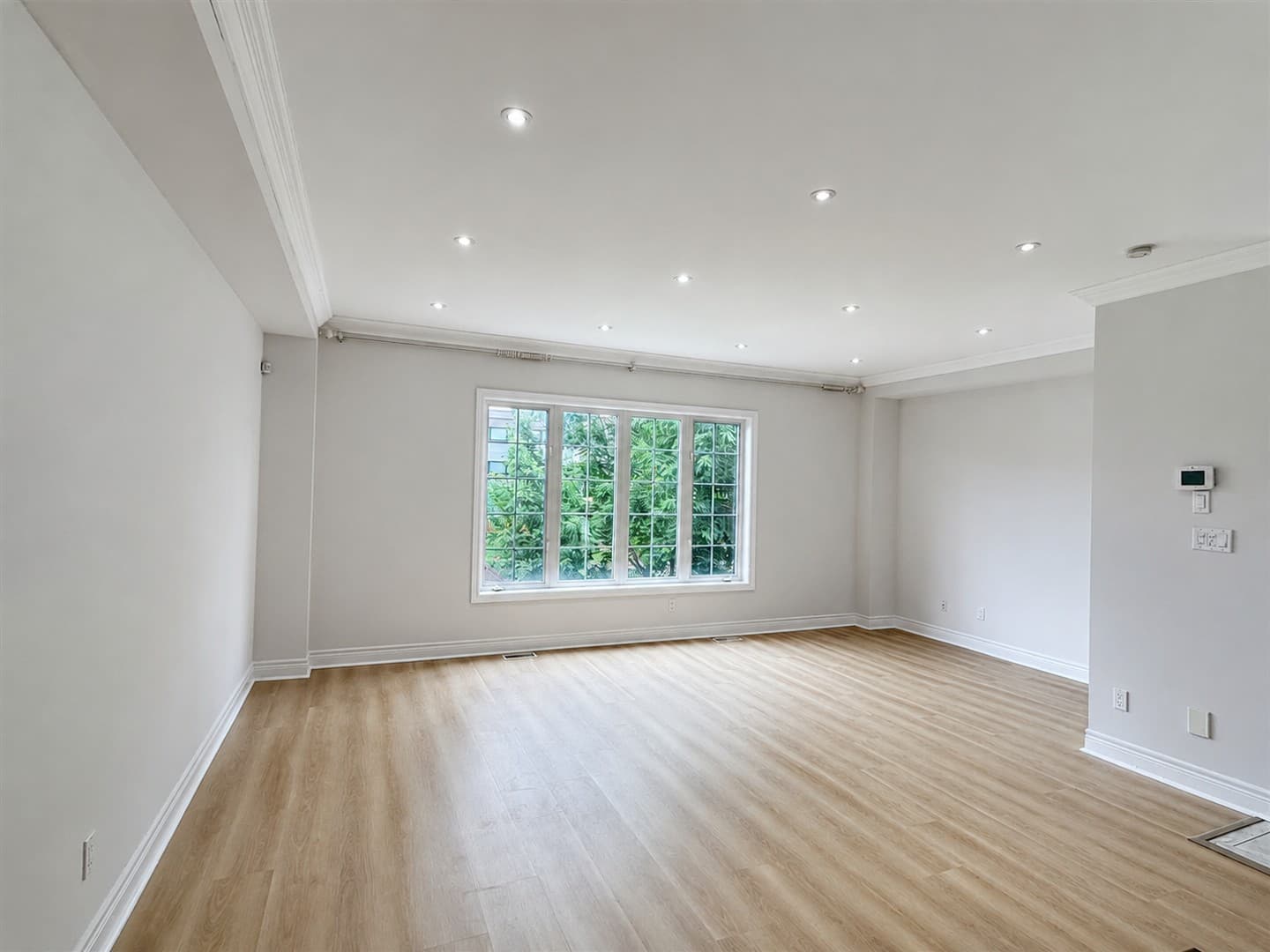Corner of empty living room with window