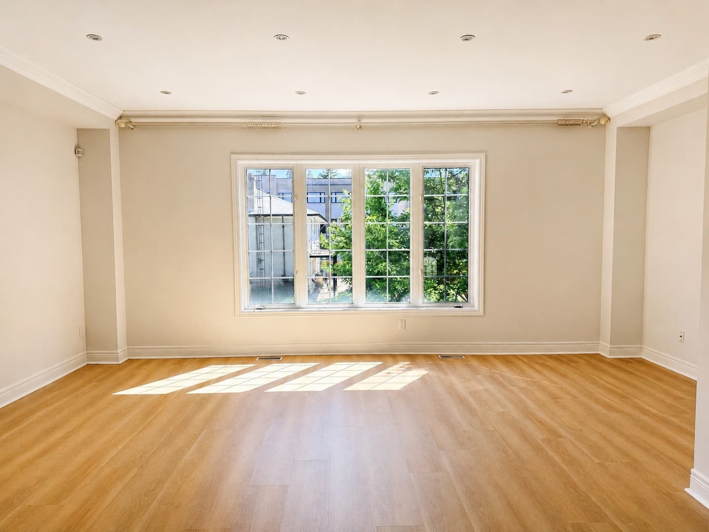 Straight-on view of the large empty living room window