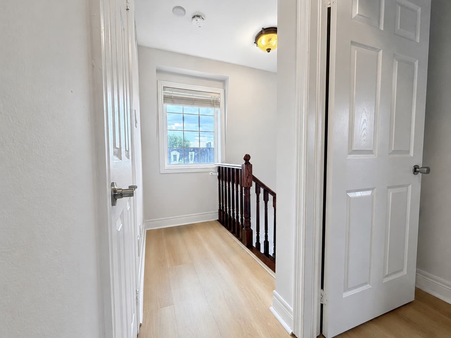 Bright window on the empty upper landing