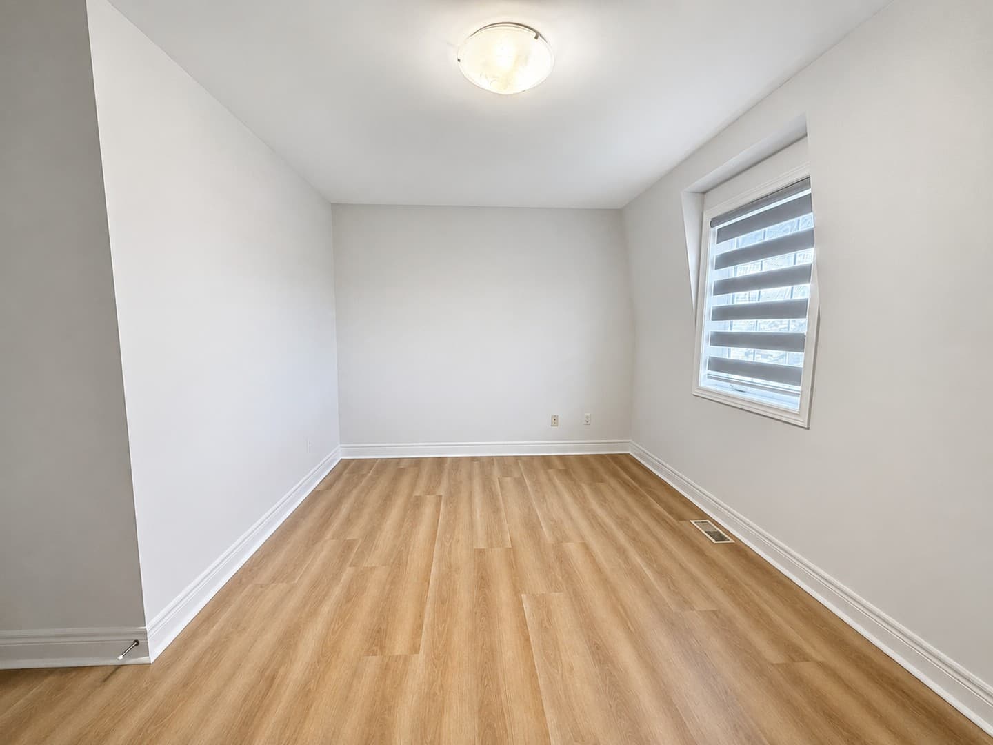 Main primary bedroom view with large empty space