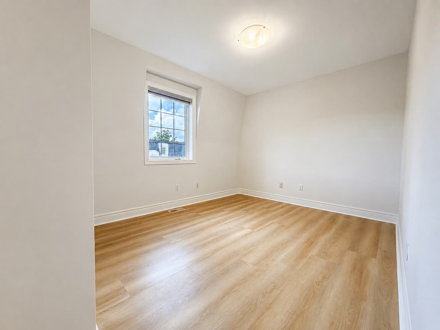 Corner angle showing empty bedroom window and wall